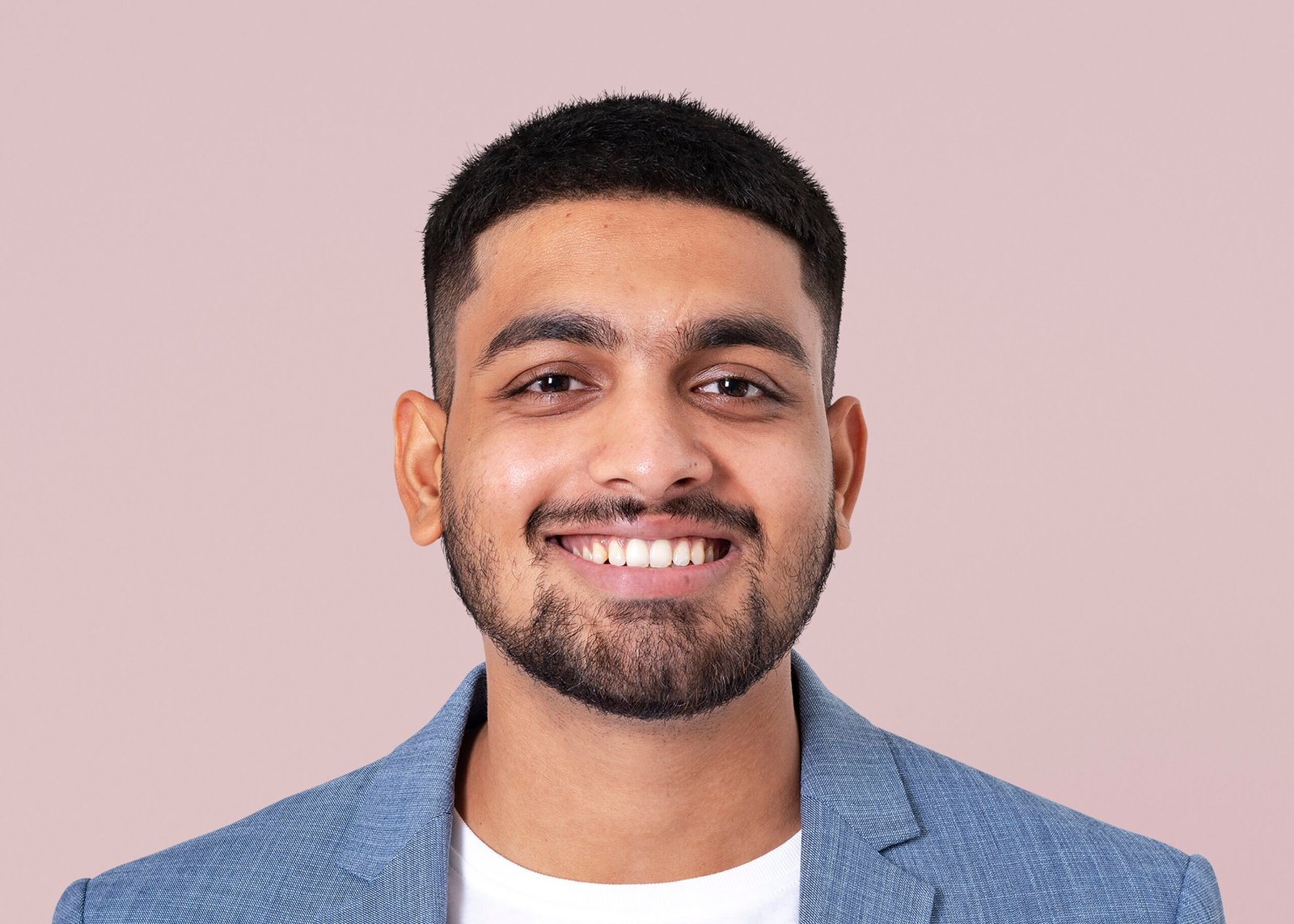 Smiling businessman face portrait, wearing suit